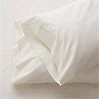 Set of two Belo ivory standard pillowcases.