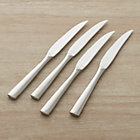Set of four Couture steak knives.