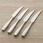 Set of four Olympic steak knives.